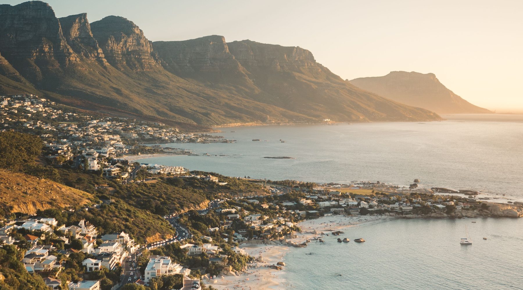 Camps Bay and the Twelve Apostles at sunset — Cape Town, where Cove Interior is based